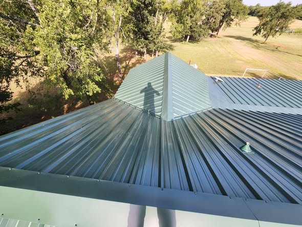 Newly installed green metal roof