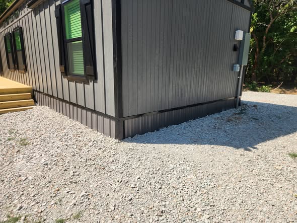 Finished metal skirting around a building